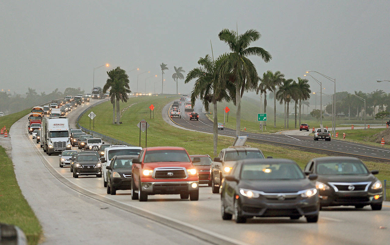 Traffic heads north along the Florida Turnpike near Homestead as tourists in the Florida Keys leave town on Wednesday. (Al Diaz/Miami Herald)