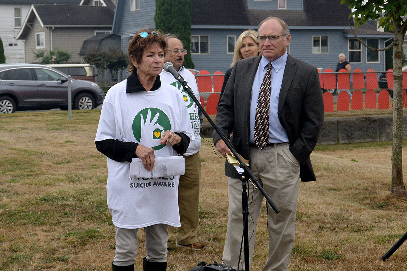 DAN HAMMOCK | THE DAILY WORLD                                Former 24th District State Representative Lynn Kessler of Hoquiam speaks at the Safer Homes Coalition suicide prevention event at Franklin Field in Aberdeen Sunday morning. Behind her is 2nd Amendment Foundation founder Alan Gottlieb. To Kessler’s left is 24th District State Senator Jim Hargrove (D-Hoquiam). Behind him is 33rd District Representative Tina Orwall (D-Auburn). The focus was removing the means of suicide by securing firearms and opioids and how to spot the warning signs of depression. Visitors got an education and were given free gun and prescription pill bottle locks.