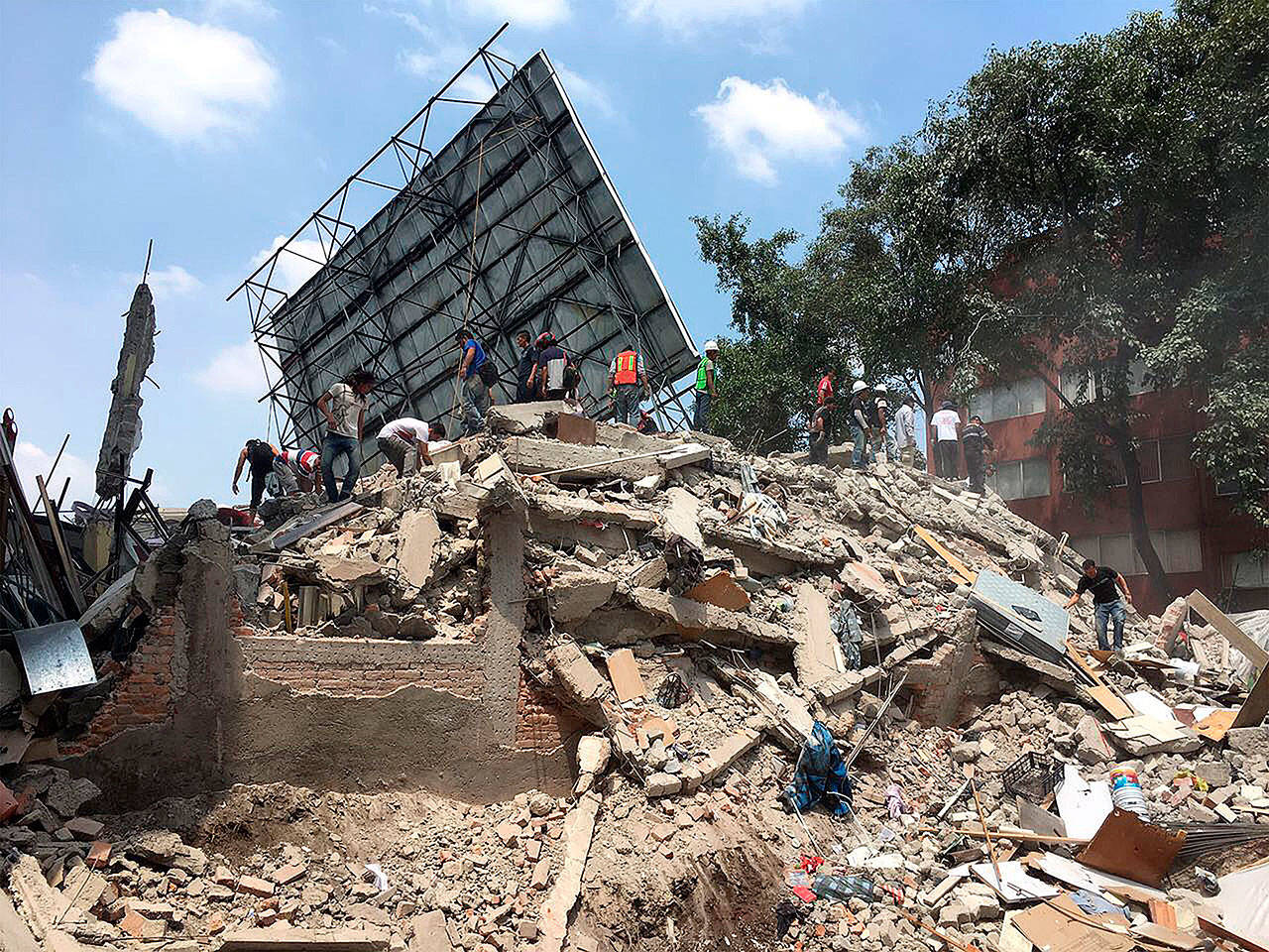 A powerful 7.1-magnitude earthquake struck Mexico City on Tuesday, collapsing buildings and sending thousands fleeing into streets exactly 32 years on the anniversary of the 1985 massive earthquake. (Prensa Internacional/Zuma Press/TNS)