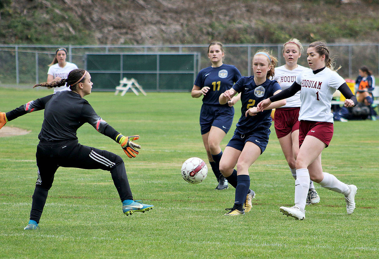 (Brendan Carl) Aberdeen’s Emmy Walsh watches her shot roll into the net to cap off a hat trick in the first half against Hoquiam on Saturday. The Bobcats defeated the Grizzlies 4-2