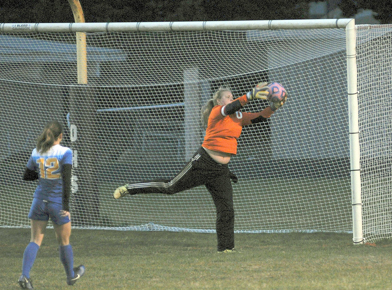 Ocosta goalie Kristi Raffelson makes a save against Adna on Monday afternoon. The Wildcats went on to win, 2-1. (Hasani Grayson | The Daily World)