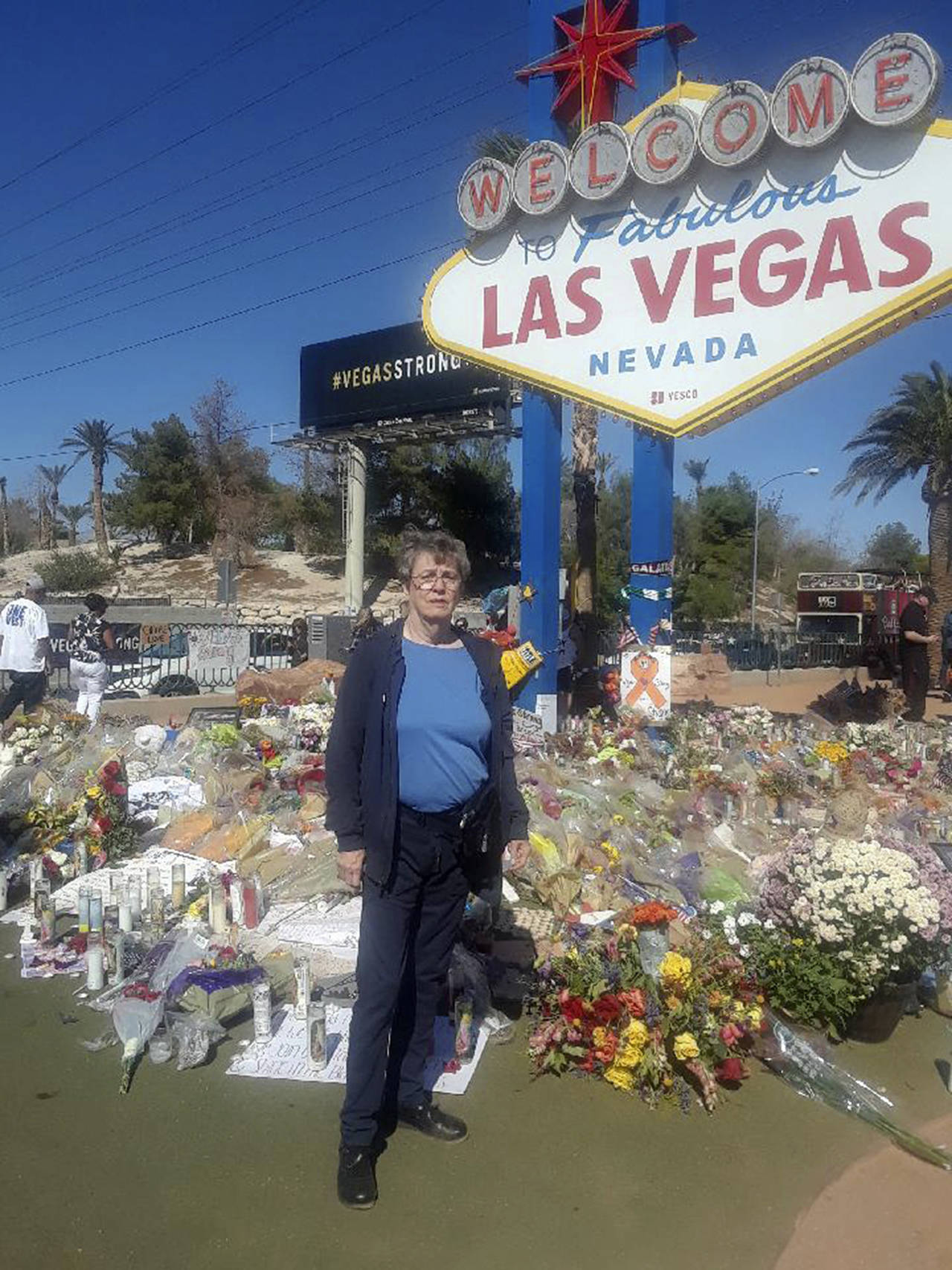 Local therapist Tobi Buckman stands by a memorial for the Las Vegas shooting victims.                                (Courtesy Tobi Buckman)