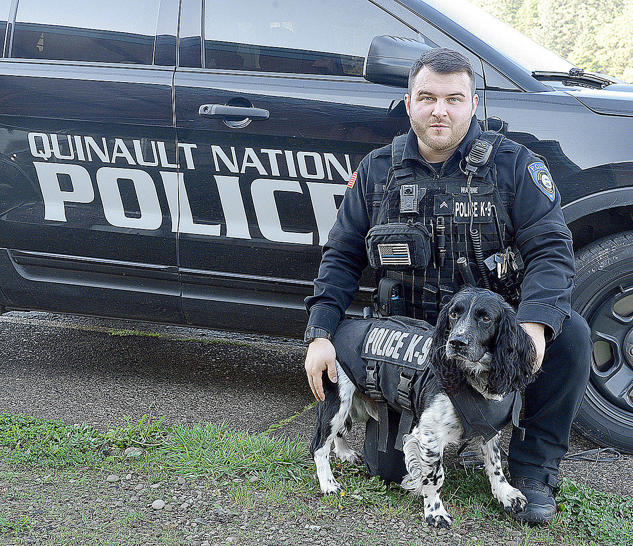 (Photo by Larry Workman) Corporal Tyler Warne with K9 Jeb.