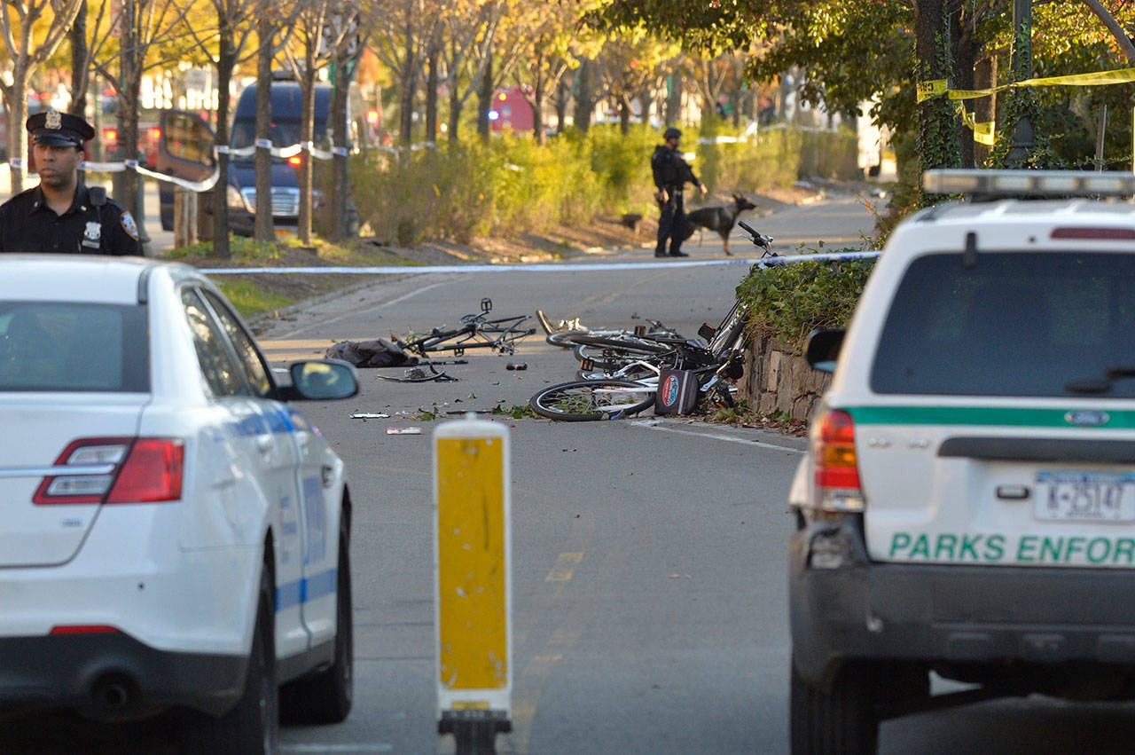 Bikes lay scattered where they were hit by a driver on West Street near West Houston Street on Tuesday after an attack in Manhattan, N.Y., leaving at least eight people dead. (Howard Simmons/New York Daily News)