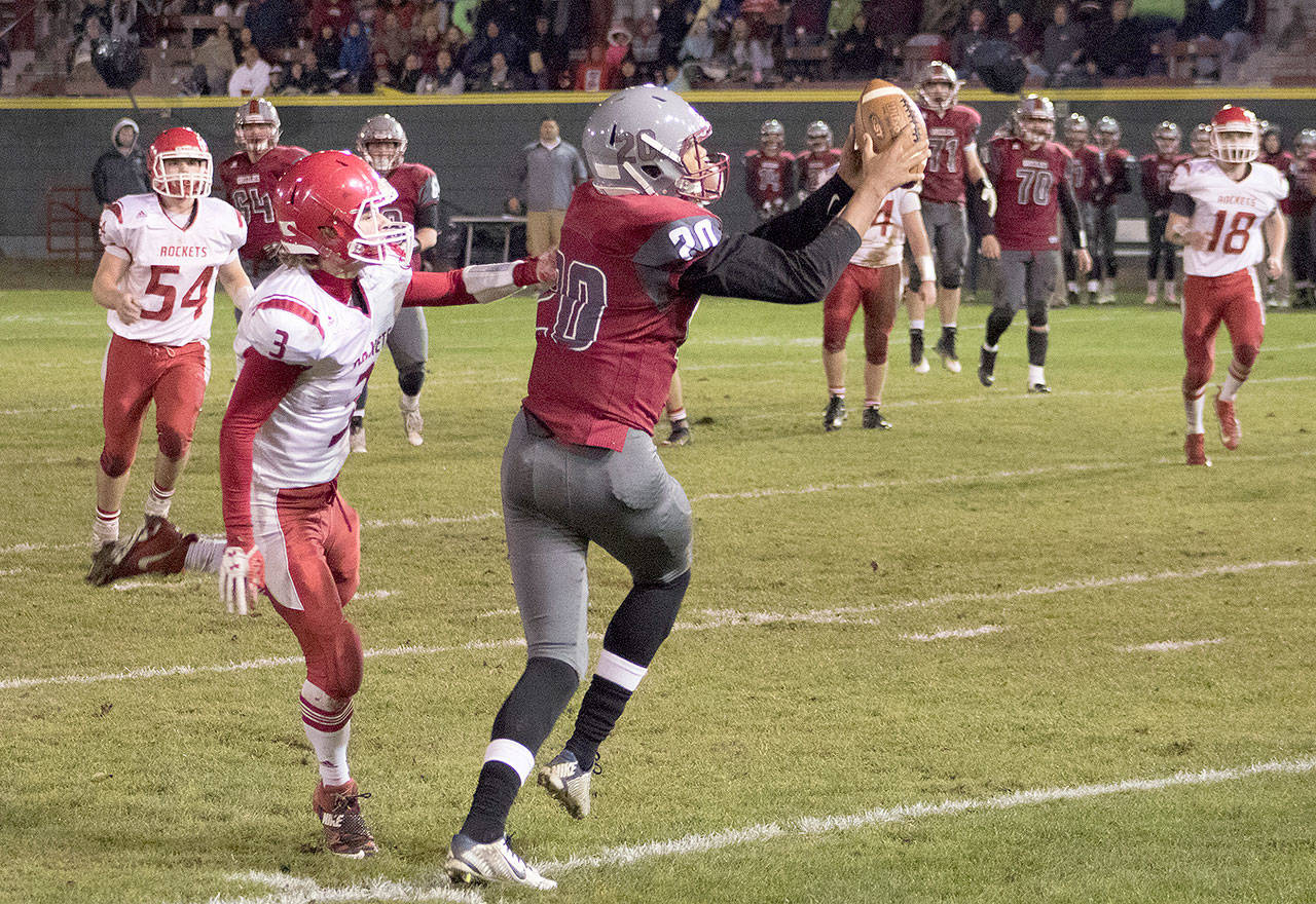Hoquiam’s Rayyon Dayton pulls in a long pass for the Grizzlies’ second touchdown against Castle Rock at Olympic Stadium on Friday night. (Brendan Carl Photography)