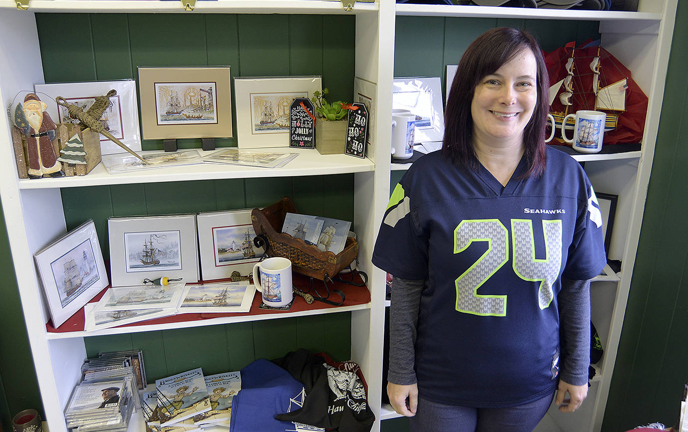 DAN HAMMOCK | THE DAILY WORLD                                The Grays Harbor Historical Seaport will open its new gift shop to the public at 2 p.m. Dec. 2 as part of the 2017 Aberdeen Winterfest. Seaport Executive Director Brandi Bogdanovich is shown here with some of the shelves where patrons can purchase T-shirts, prints and other items.