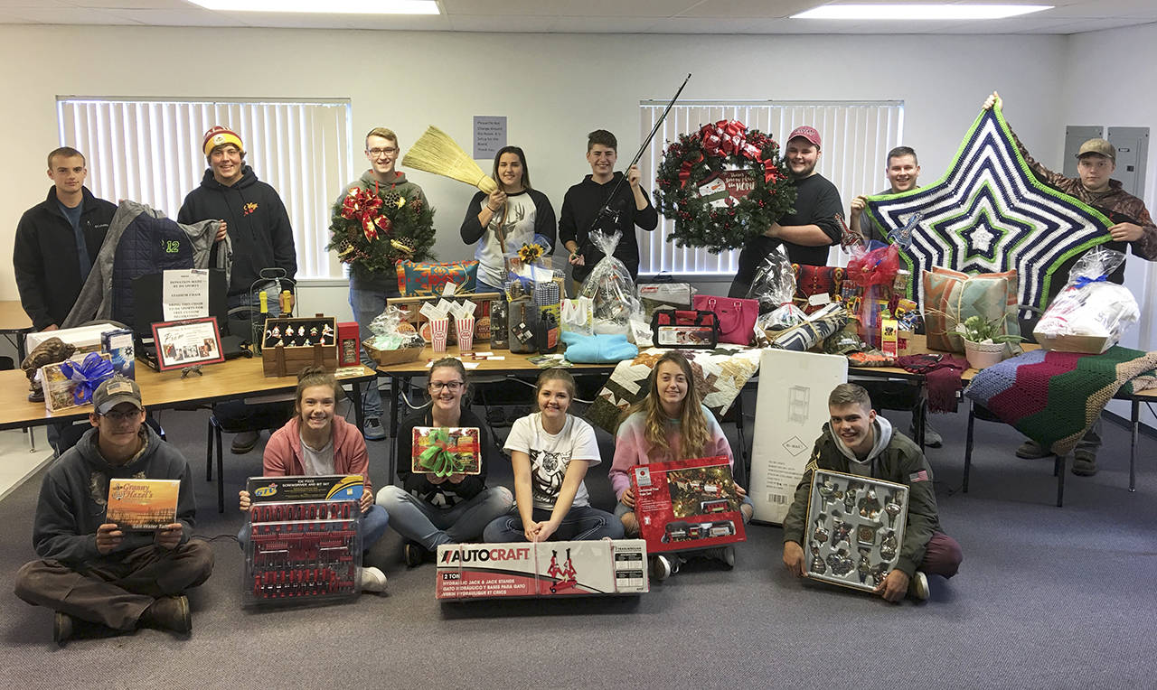 Courtesy photo                                Members of Ocosta’s senior class display items to be auctioned at Saturday’s fundraiser.