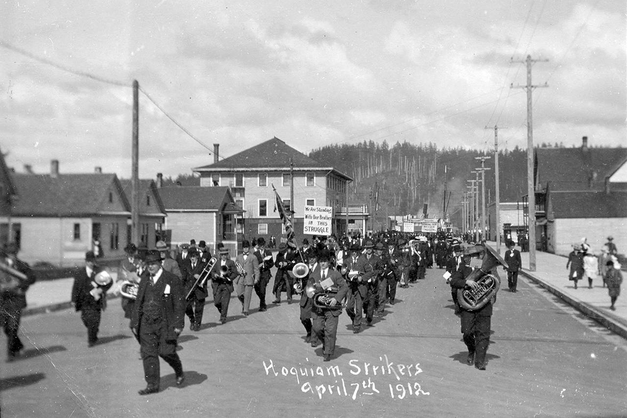 Courtesy Polson Museum                                A group of striking Hoquiam sawmill workers march west along Sixth Street on April 7, 1912. This was one of the early instances in Hoquiam when the Industrial Workers of the World attempted to mobilize mill and other workers on the Harbor.