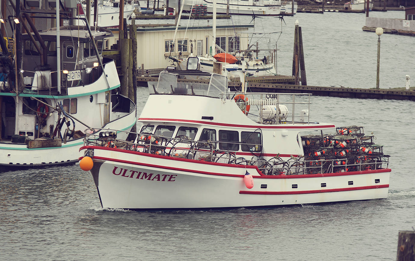 COURTESY PHOTO                                A commercial crab boat leaves Westport Marina, its deck stacked with pots. Westport placed 10th in the nation in 2016 in total weight of seafood landed, 108 million pounds, and 14th in total value, $59 million.