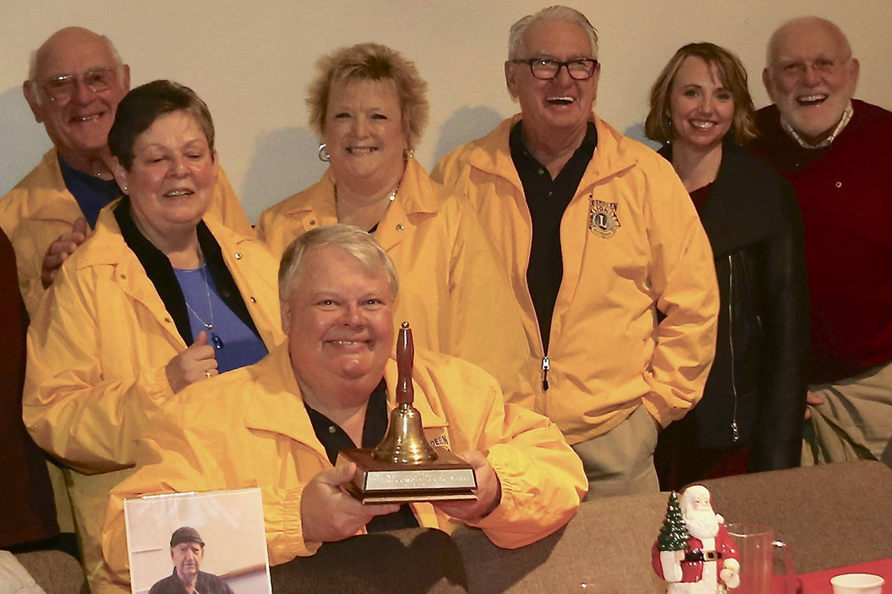 Courtesy photo                                Bob Braden holds the first-place trophy bell, surrounded by fellow members of the Aberdeen Lions Club.