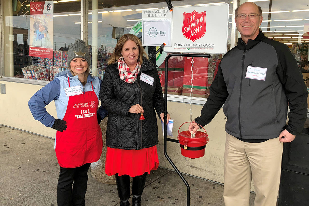 Courtesy photo                                 Timberland President Mike Sand led a shift of volunteer bell ringers at the Dollar Tree on Dec. 5, along with (from left) employees Dannette Cady and Diane Peters.