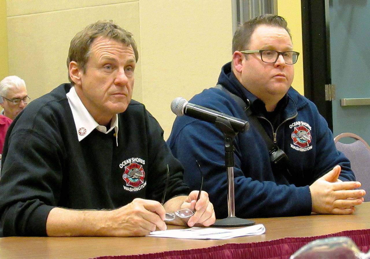Scott D. Johnston photo: Fire Chief David Bathke, left, and Capt. Brian Ritter appear before the Ocean Shores City Council on Nov. 13
