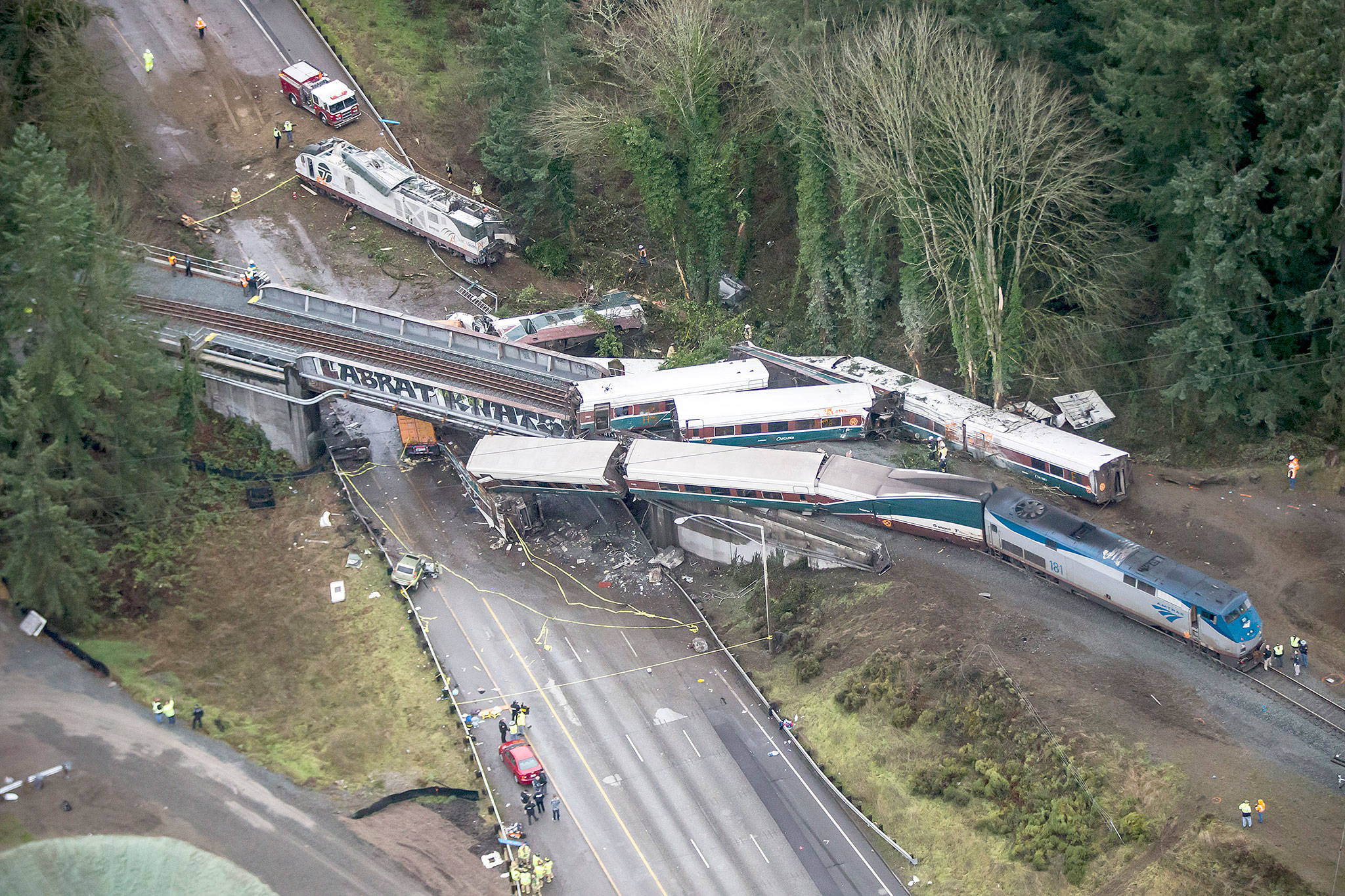 An Amtrak train derailed and fell off of a bridge and onto Interstate 5 near Mounts Road between Lakewood and Olympia on Monday. (Bettina Hansen/Seattle Times)