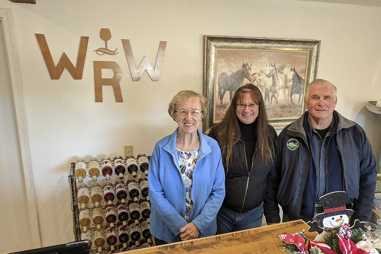 Corey Morris | Twin Harbors Newspaper Group                                Denise Schupbach (center) has opened a winery up the Wynoochee Valley featuring several varieties of berry wines. Family members including Kay Comin and Tom Skinner help with the process.