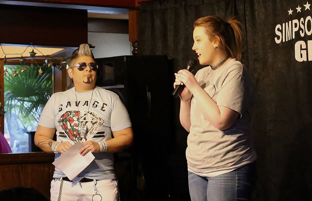 (Courtesy Sarah O’Neal) Local Drag King performer Ceasar Hart (left) and Revival of Grays Harbor founder Emily Reed speak at last Sunday’s drag show at Simpson Avenue Grill in Hoquiam. Saturday’s show at the Eagles club in Aberdeen will be a fundraiser for Revival.