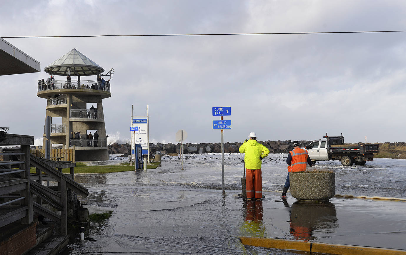 DAN HAMMOCK | THE DAILY WORLD                                Waves pummeling the Westport jetty Thursday caused flooding on several blocks of Westhaven Drive.