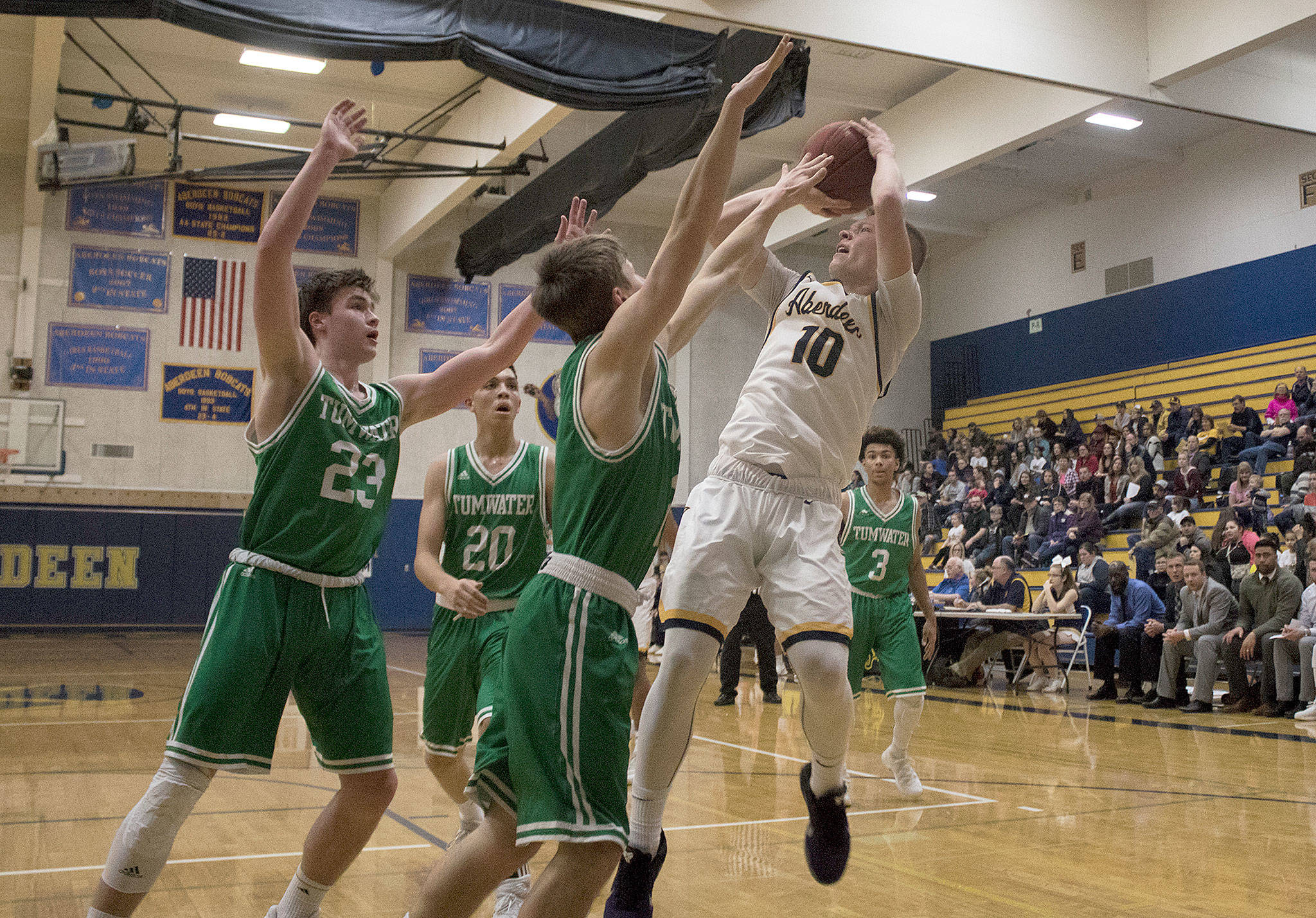Aberdeen’s Ben Dublanko puts up a shot over two Tumwater defenders during an Evergreen 2A contest at Sam Benn Gym on Friday night. Dublanko led the Bobcats with 21 points in a 71-53 loss to the Thunderbirds. (Brendan Carl Photography)