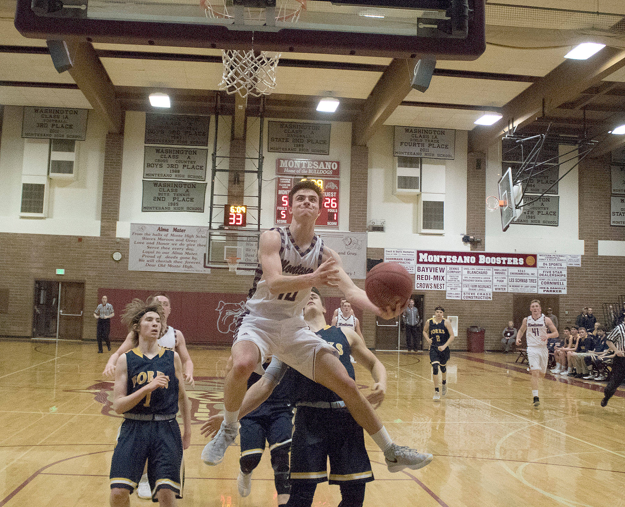Montesano’s Trevor Ridgway soars to the basket for a layup against Forks on Tuesday. (Brendan Carl Photography)