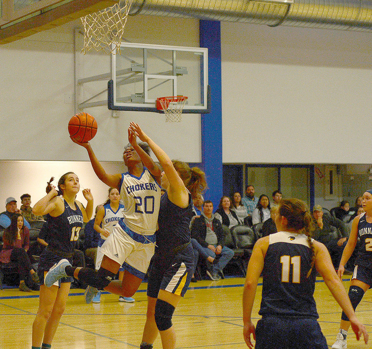 Alexia Thrower finishes at the rim in a game at Choker Gym. Thrower leads the NWAC in scoring averaging 26.4 points per game. (Hasani Grayson | The Daily World)