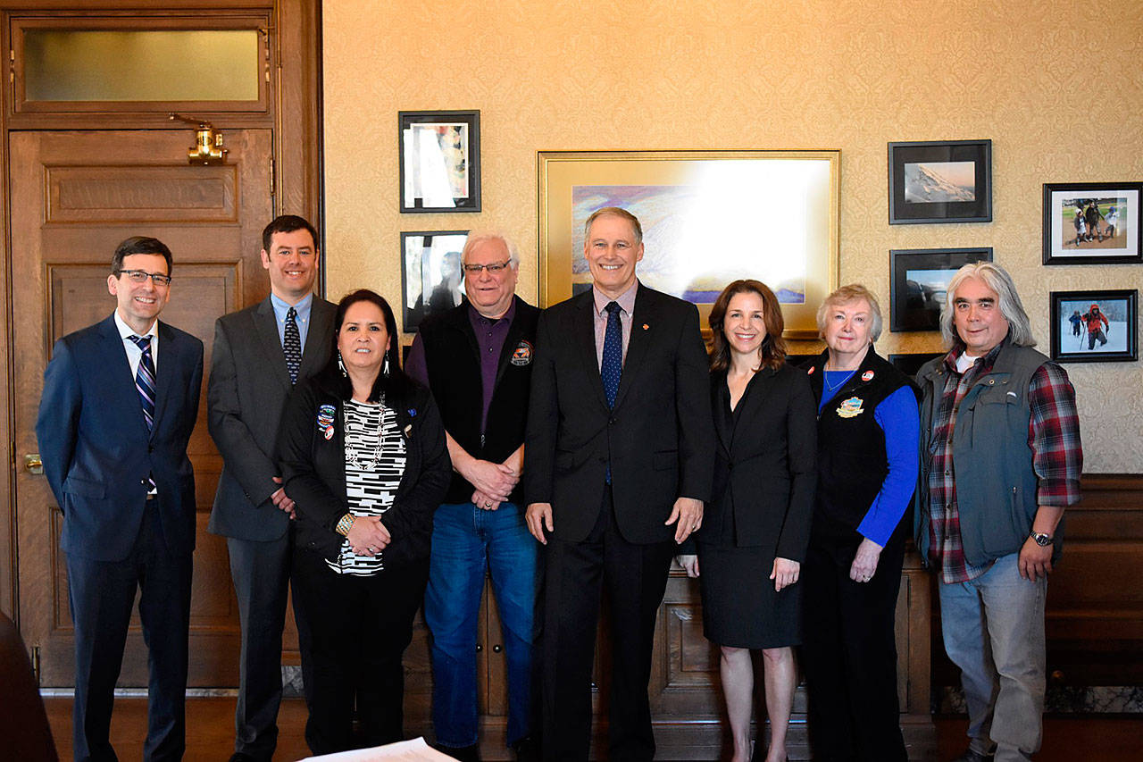 Left to right: Attorney General Bob Ferguson; Gus Gates, Surfrider Foundation; Gina James, Quinault Nation Business Council member; Larry Thevik, president of the Dungeness Crab Fisherman’s Association; Gov. Jay Inslee; Hilary Franz, Commissioner of Public Lands; Crystal Dingler, mayor of Ocean Shores; and Chad Bowechop, manager of Office of Marine Affairs, Makah Tribe. (Office of the Governor photo)