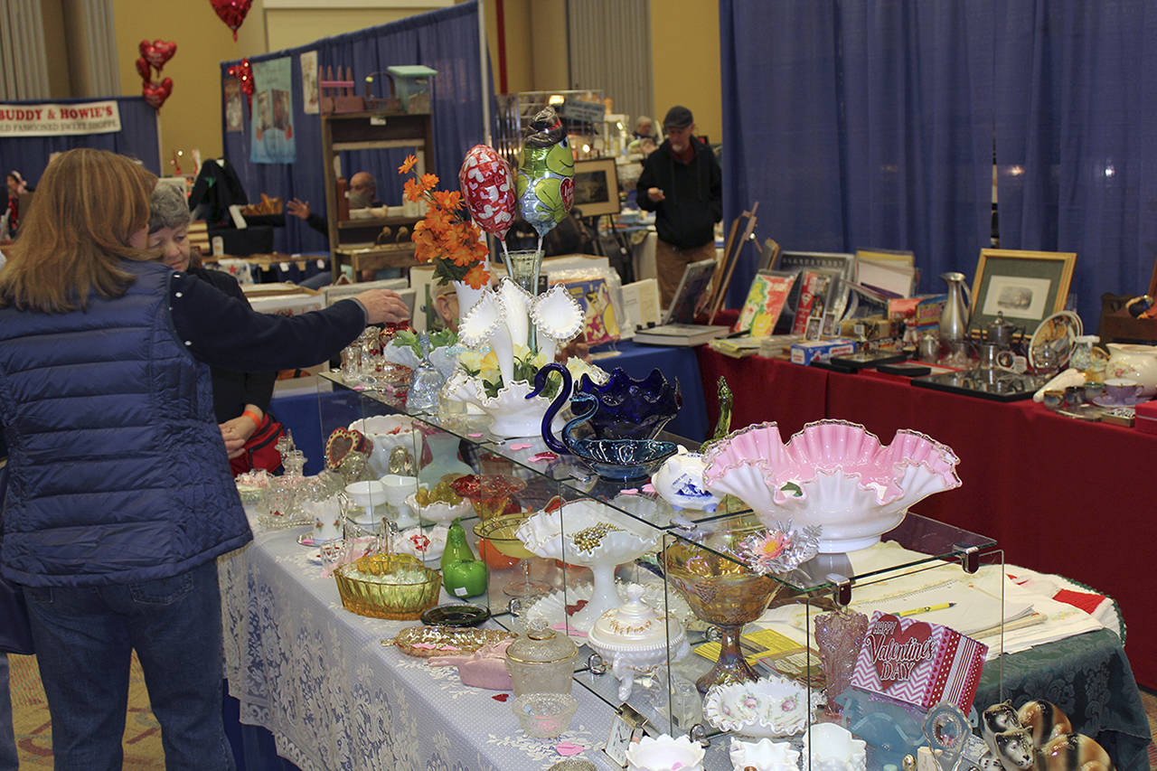 (File photo) Shoppers browse booths at last year’s Renewed Antiques Show at the Ocean Shores Convention Center.
