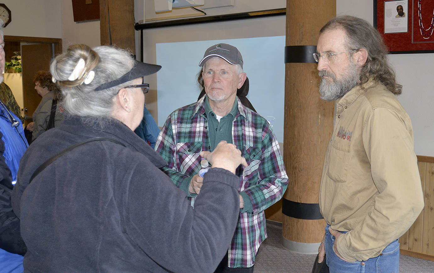 DAN HAMMOCK | THE DAILY WORLD                                Pacific County Drainage District #1 boar chairman David Cottrell (right) speaks with property owners along the north Willapa Harbor shoreline after a meeting discussing the timeline of shoreline protection efforts to fight erosion over the next year.