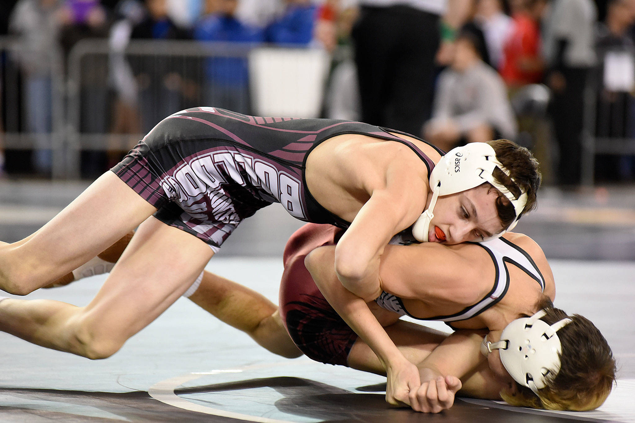 Montesano’s Ty Ekerson gets control of Medical Lake’s Weston Thomas in a first-round match Friday. Ekerson won, 12-6. (Photo by Sue Michalak)