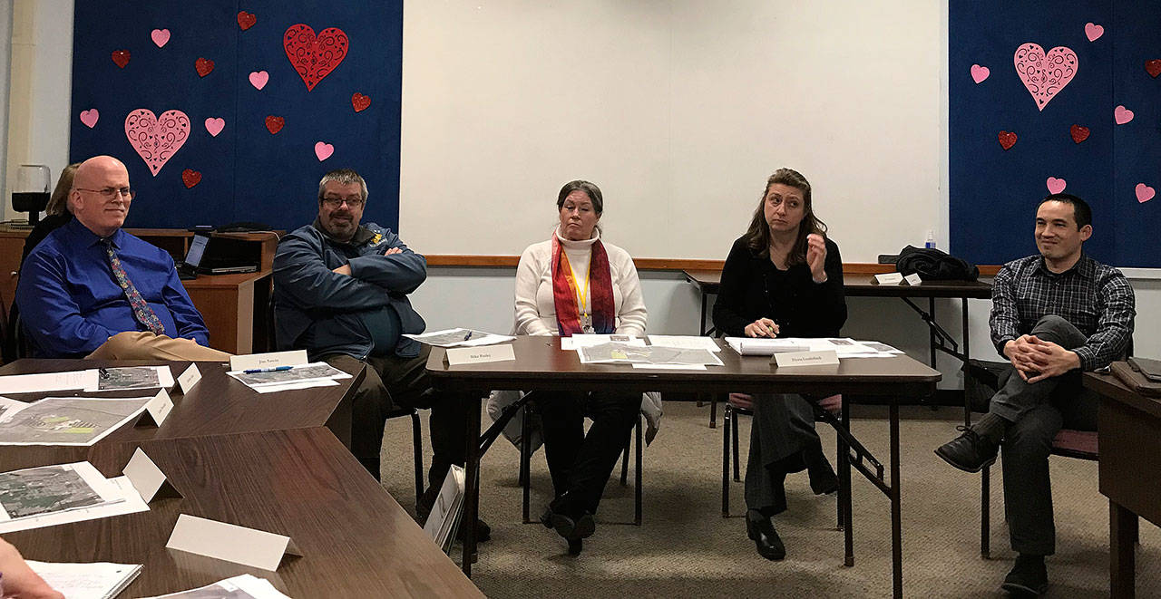 LOUIS KRAUSS | THE DAILY WORLD Members of the new task force to discuss relocating Stevens Elementary discuss background information at the Aberdeen School District building Thursday afternoon.