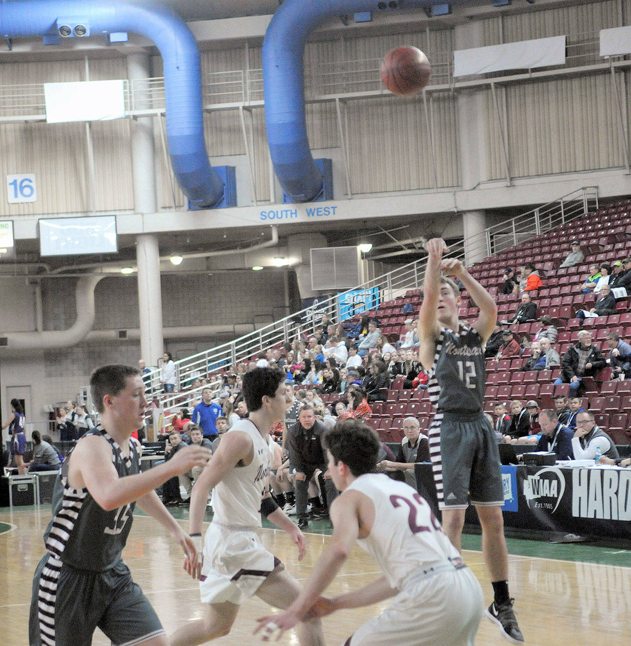 Sam Winter hits a thee point shot in the second quarter against Northwest at the 1A State Tournament. Winter led the team with 10 points. (Hasani Grayson | The Daily World)