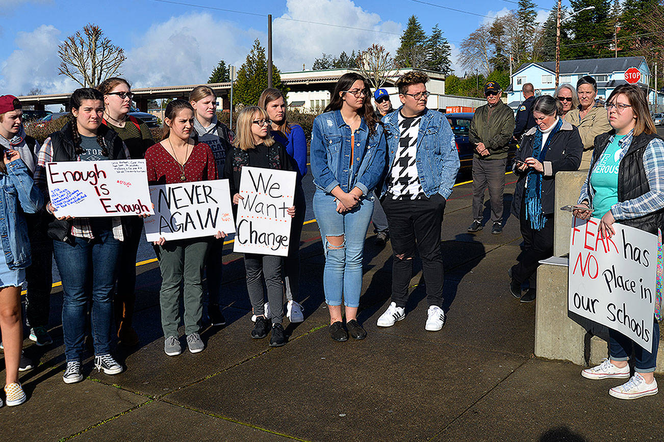 LOUIS KRAUSS | THE DAILY WORLD Aberdeen High School senior Nadia Wirta, far right, addresses the crowd during Wednesday’s walkout to protest gun violence. Approximately 75 students participated, as did some in other schools around Grays Harbor.