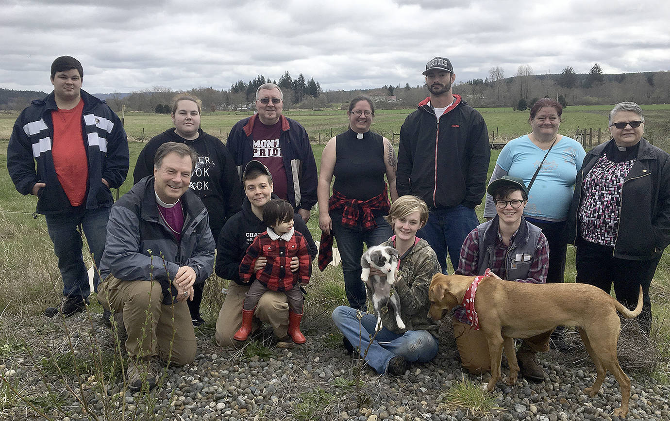 HARBOR ROOTS FARM PHOTO                                Harbor Roots Farm will break ground Tuesday on three acres of leased land on the Wynoochee Valley. Back row from left: James Petersen-Yeager, Mashyla Buckmaster, Jim Campbell, Reverend Sarah Monroe, Donald Jackson, Janet Belles, Reverend Bonnie Campbell. Front row left: Bishop Greg Rickel, Aaron Scott and Moses, Nita Cross and Silas the dog, Hannah Jones and Archie the dog.