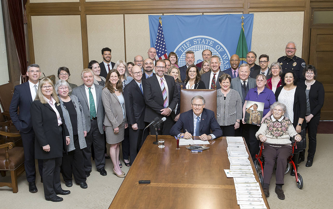 Gov. Inslee signed Engrossed Substitute House Bill No. 1047, March 22, 2018. Relating to protecting the public’s health by creating a system for safe and secure collection and disposal of unwanted medications. Hoquiam Police Chief Jeff Myers, a longtime proponent of the legislation, is in the back row right as the Governor signs the bill.