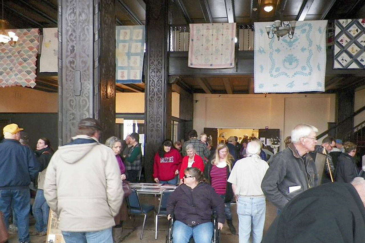 (Courtesy Connie Parson) Attendees at last year’s Historic Hoquiam Memories event peruse the exhibitors at Emerson Manor. This year’s event will feature 20-plus exhibitors.
