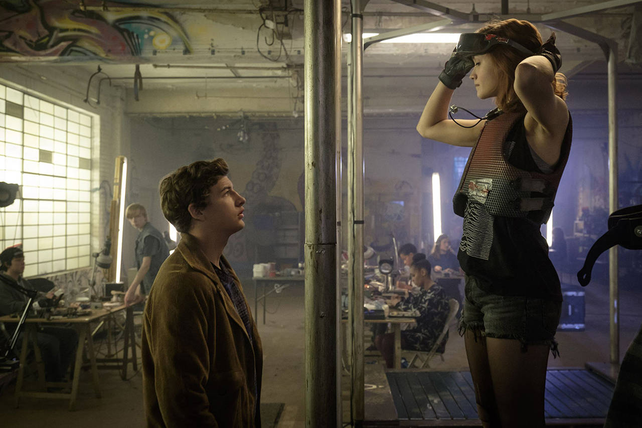 The romance between Parzival (Tye Sheridan, left) and Artemis (Olivia Cooke) is adorable in a corny sort of way in “Ready Player One.” (Warner Bros. Pictures)