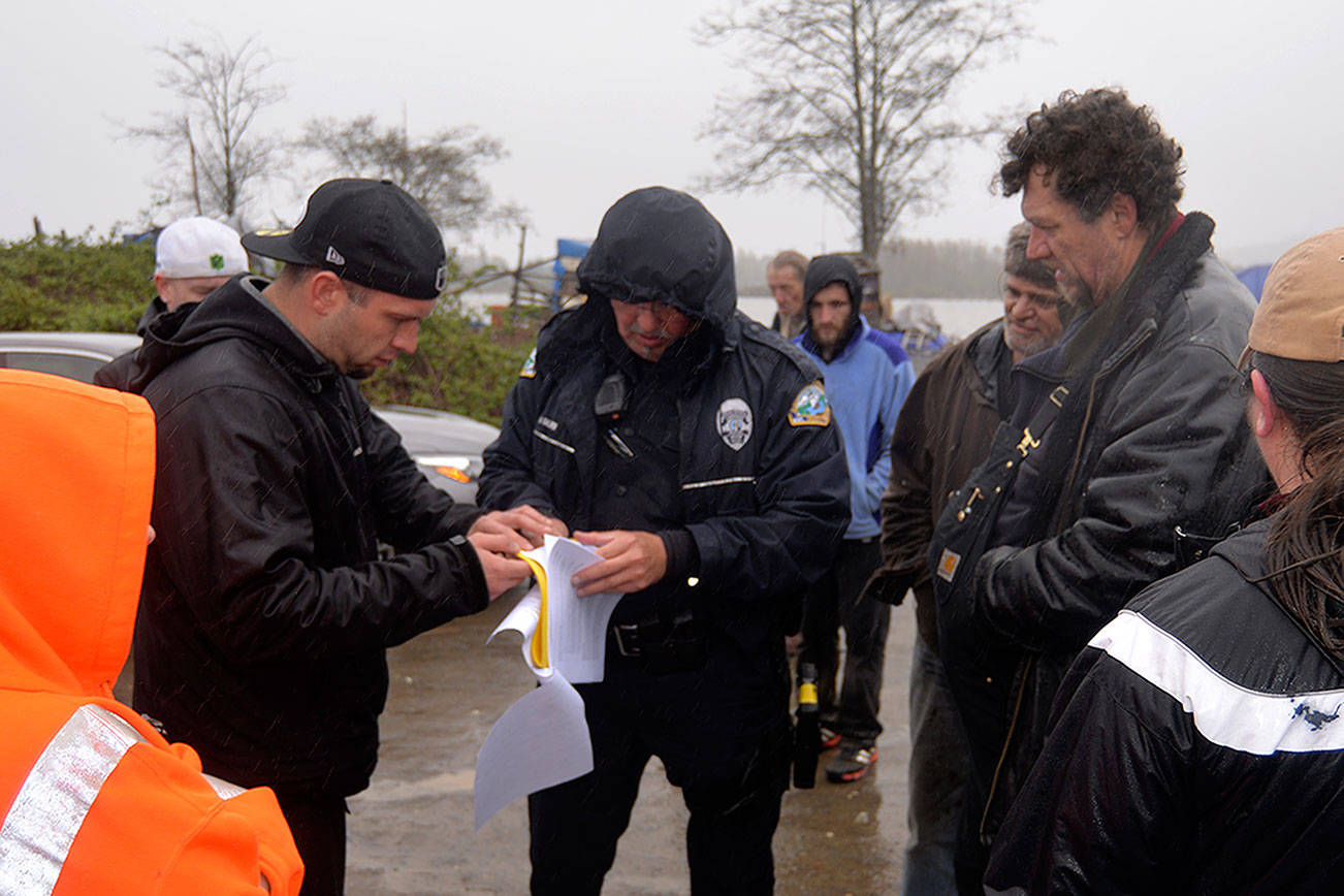 Group looking to tow vehicles from riverfront camps told by police to
