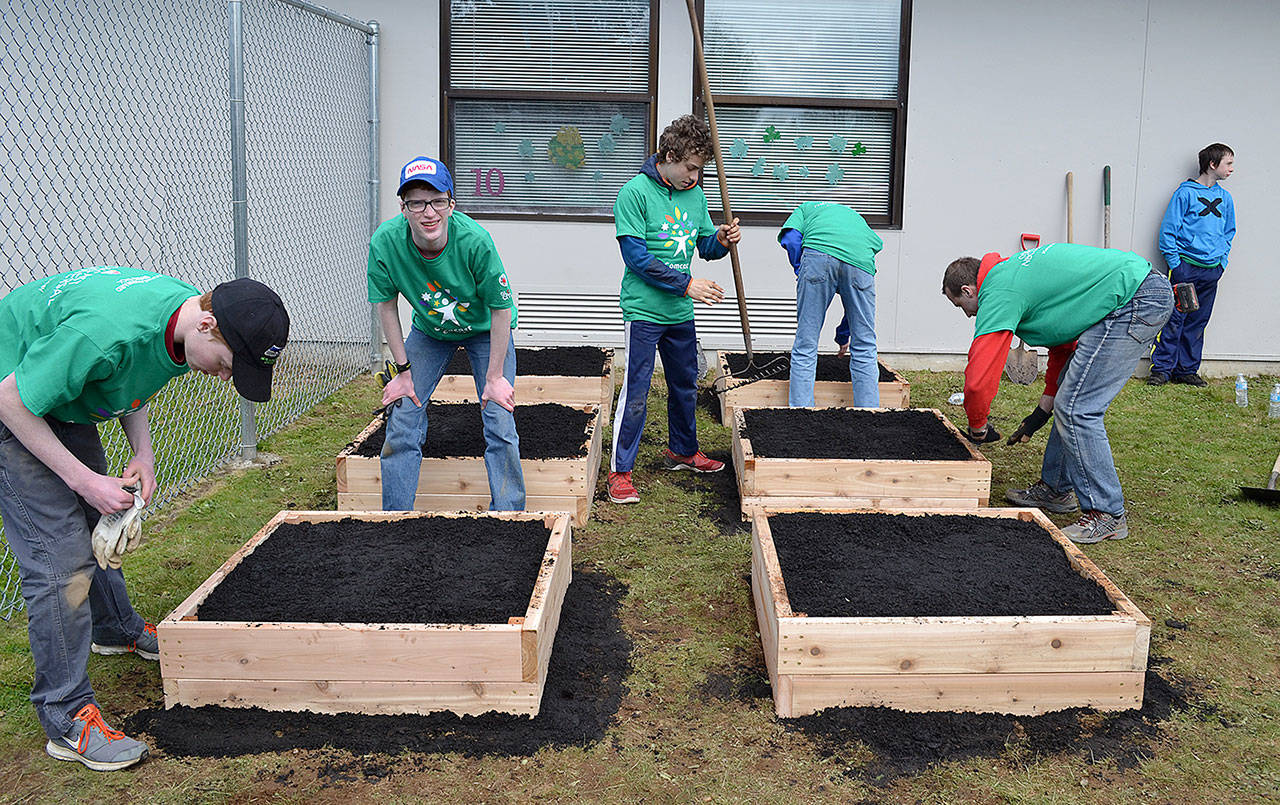 COMCAST COURTESY PHOTO                                A local Eagle Scout troop helps build Kinder Gardens for students at Central Park Elementary School.