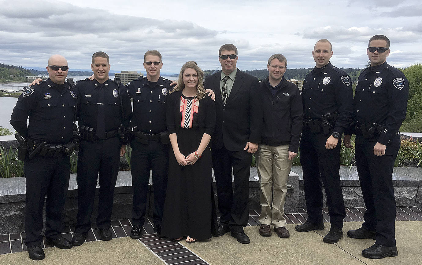 HOQUIAM POLICE DEPARTMENT PHOTO                                Officers from the Hoquiam Police Department flank Cierra McCartney, widow of fallen Pierce County Deputy, at the presentation of a medal of honor and the addition to Daniels name being added to the law enforcement memorial May 4 in Olympia. From left are Officer Luce, Officer Figg, Officer Blundred, McCartney, Sgt. Dayton, IT Specialist Bradley, Officer Spaur and Officer Verboomen.