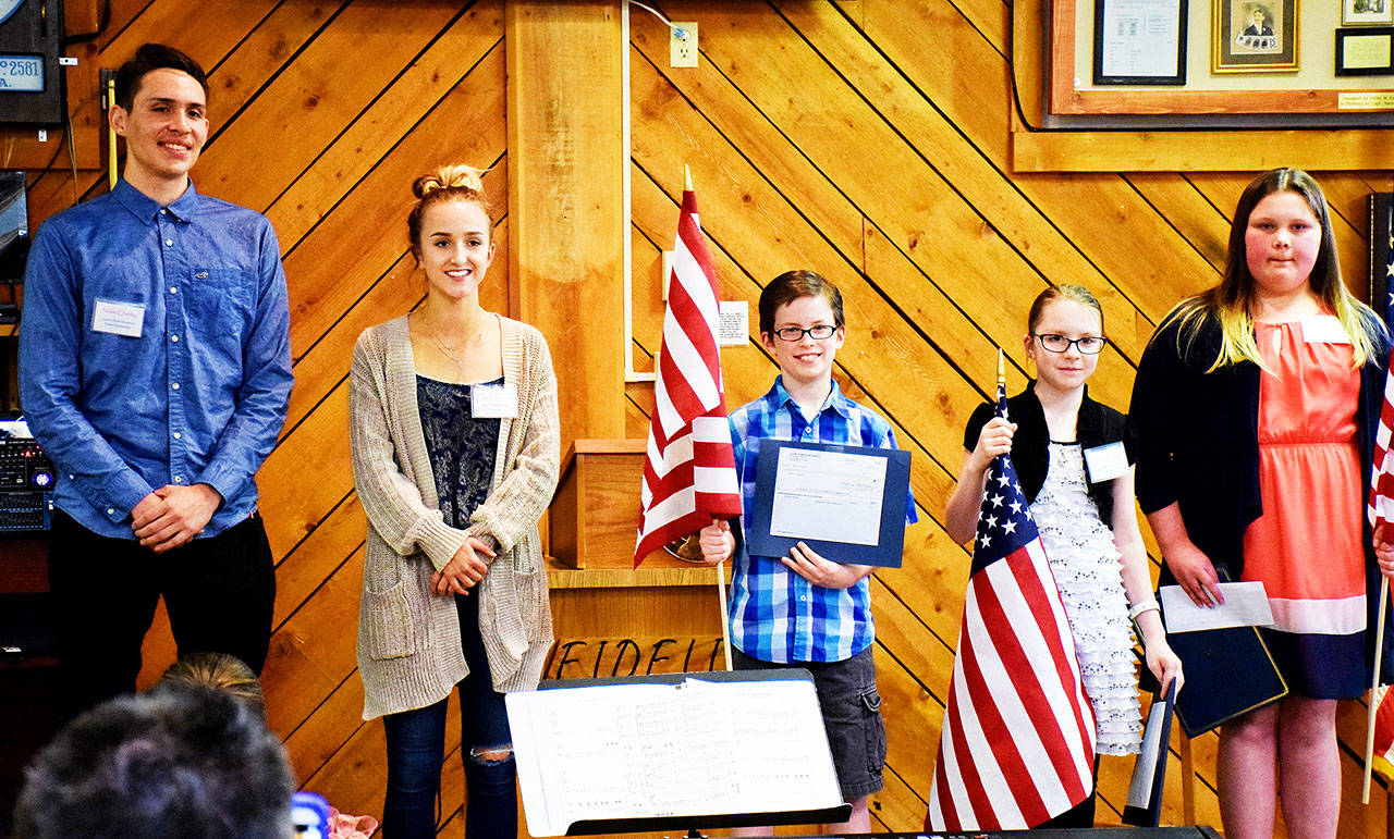 Photo by Scott D. Johnston                                 Scholarship winners, from left, are Nolan Lee Charley and Tawni Blankenship of North Beach High School (Joyce Hoy not present), with Americanism Essay Contest winners Brennen A. Jacobsen, Cecelia Trudeau and Callie Harnagy of Ocean Shores Elementary School.