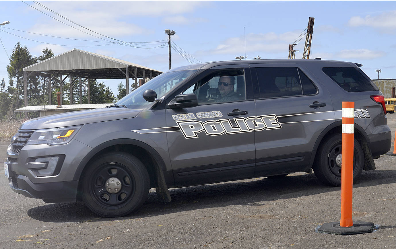 DAN HAMMOCK | THE DAILY WORLD                                Sgt. David McManus from the Ocean Shores Police Department negotiates a narrow track in reverse at the skills section of the driving course taught by instructors from the Hoquiam and Montesano police departments May 24.