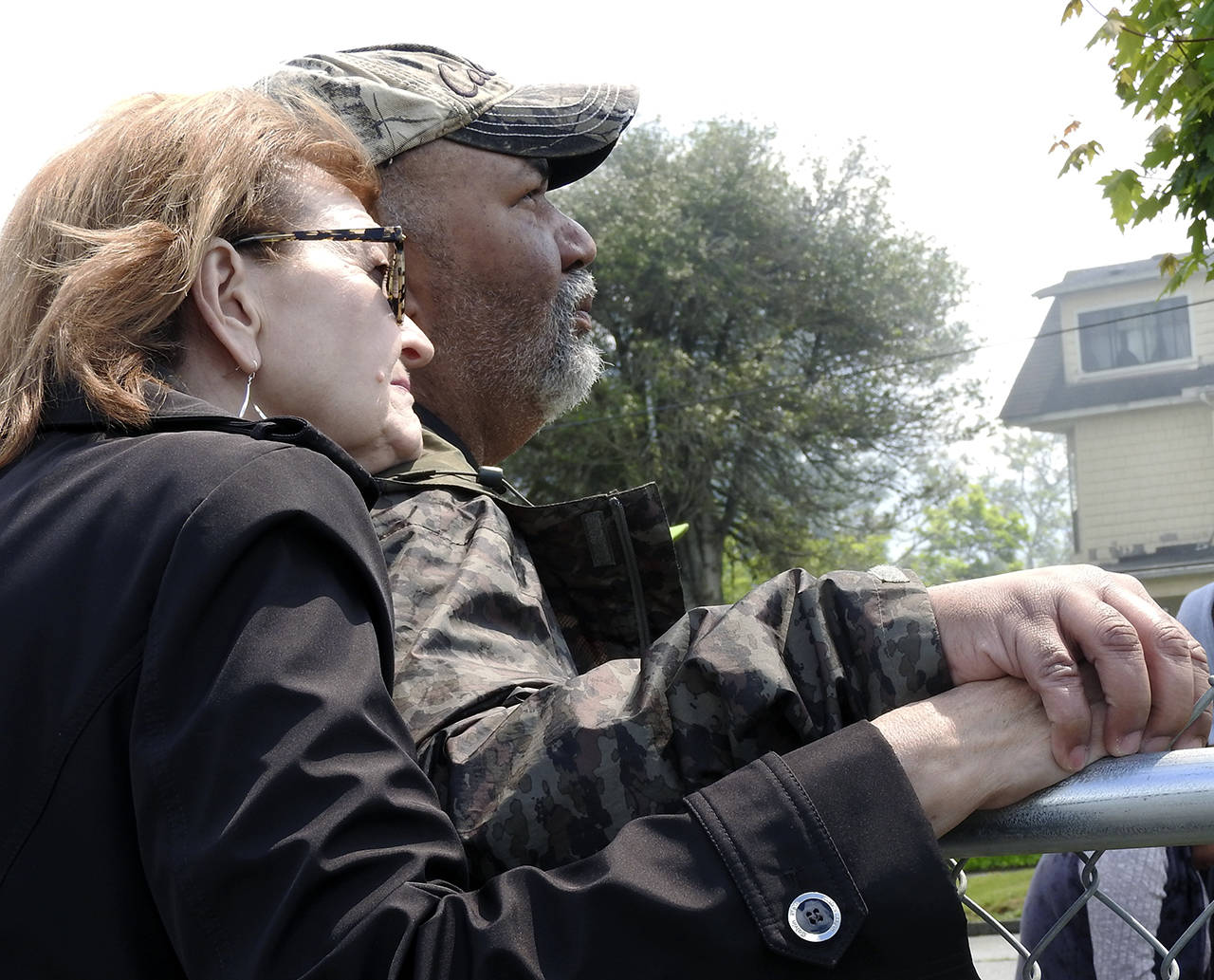 (Kat Bryant | The Daily World) Longtime museum volunteer Becky Carossino comforts Dave Morris, executive director of the Aberdeen Museum of History, during the fire.