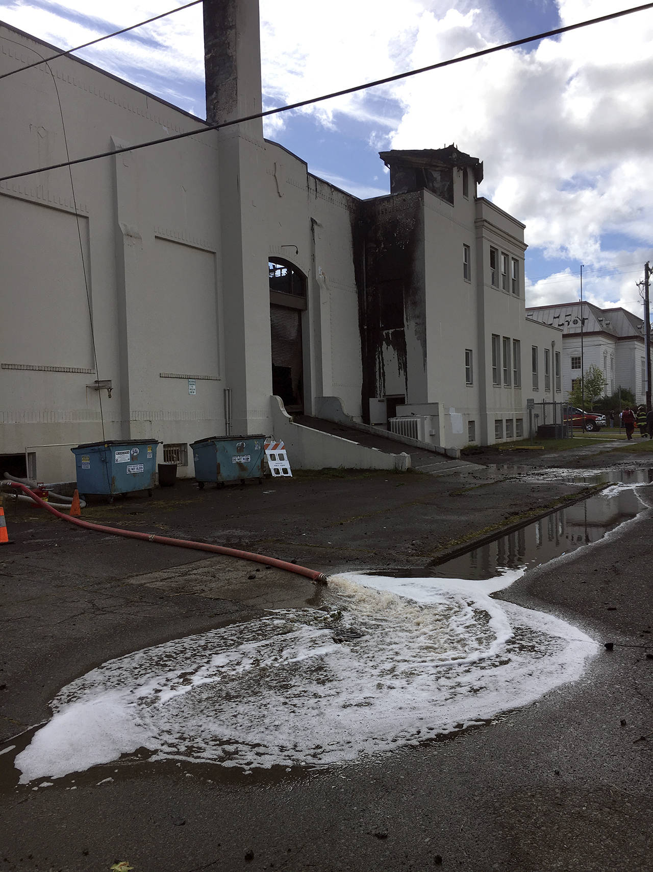 (Kat Bryant | The Daily World) Aberdeen Fire Department pumps water out of the Armory basement after the fire was put out.