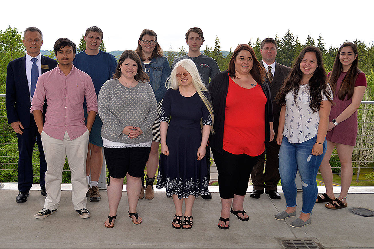 Grays Harbor College President Jim Minkler, top left, stands with this year’s top scholars. Top row from left after Minkler: Ben Burkhart, Emily Bjornsgard, Joshua Latimer, Richard Mudd, Emily Grace Takagi. Bottom row from left: Tigre Falla, Juli Hedrick, Hannah Raaberg, Andrea Andrews, and Cora Pope. Not pictured: Seth Brink and Kristen Edwards.