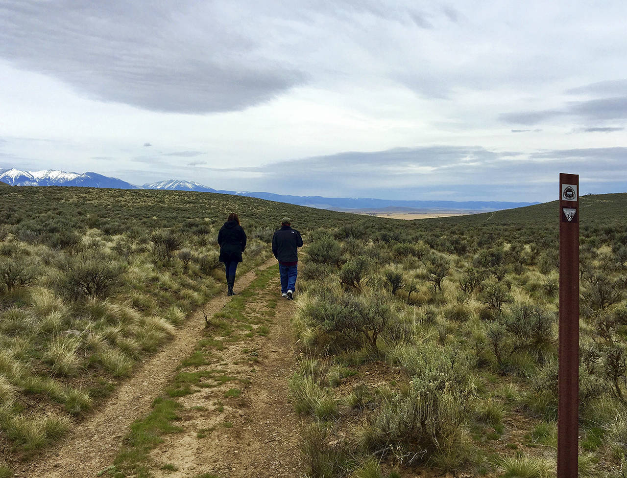 Terri Colby | Chicago Tribune                                 Visitors to the National Historic Oregon Trail Interpretive Center outside Baker City, Oregon, walk in the ruts formed when hundreds of thousands of pioneers crossed this route headed to the towering Blue Mountains.
