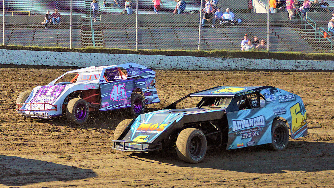 Tiana Berkeley,left, and Alan Muenchow race into turn one of the Washington Modifieds feature race on Saturday in Elma. (Photo by AR Racing Videos)