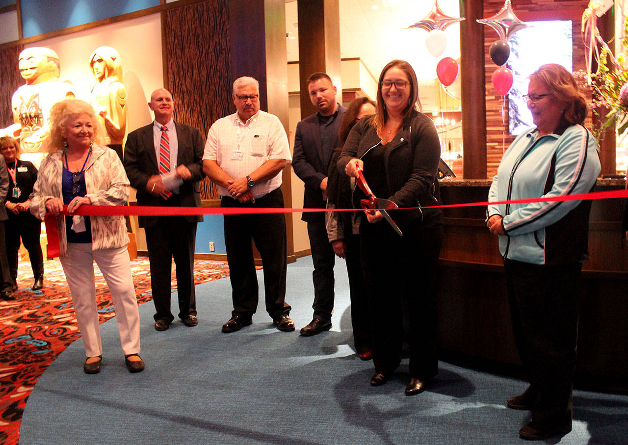 Angelo Bruscas/North Coast News photo:                                Melanie Montgomery, chair of the Quinault Nation Enterprise Board, cuts the ribbon on the new expansion at the Quinault Beach Resort & Casino on Friday.