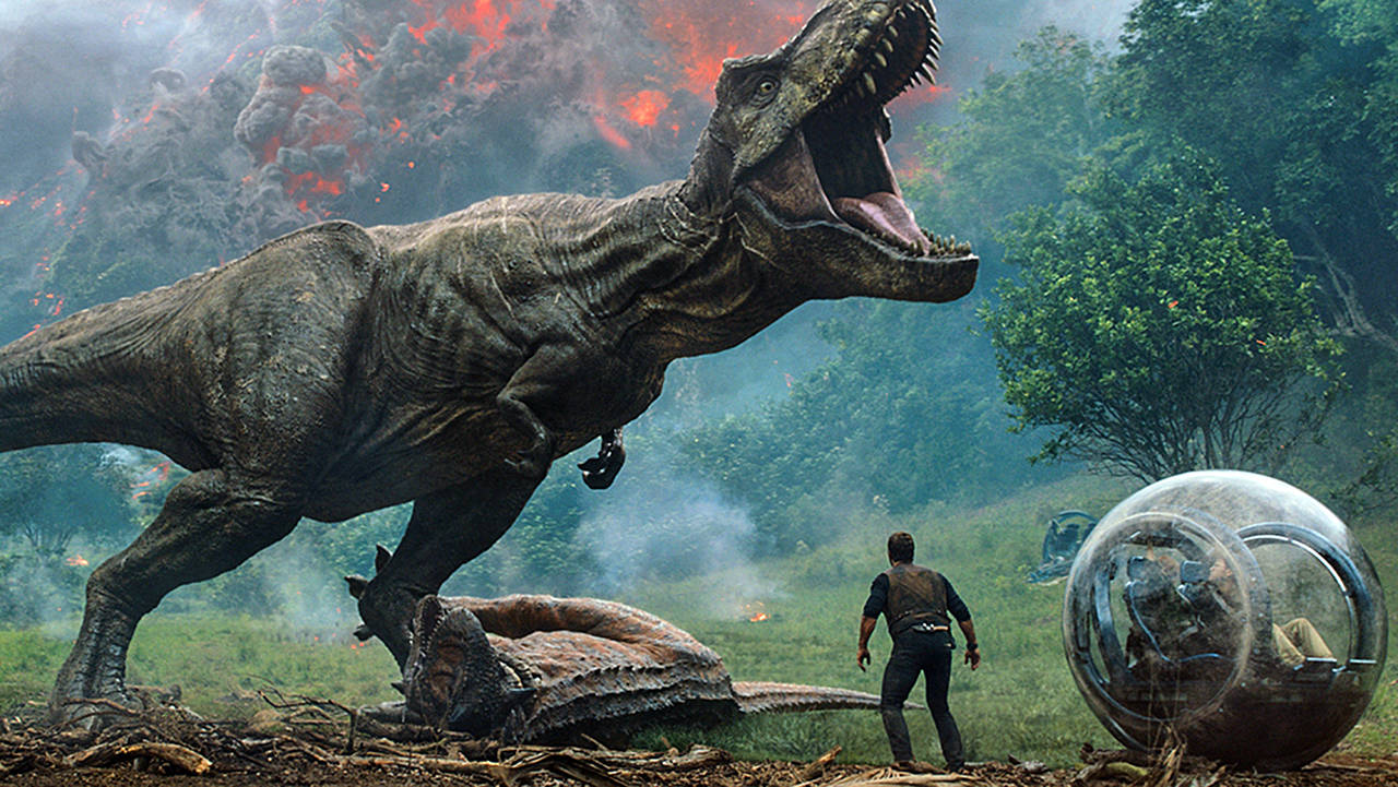 Universal Pictures and Amblin Entertainment                                 Chris Pratt as Owen Grady faces the Tyrannosaurus rex in “Jurassic World: Fallen Kingdom.”