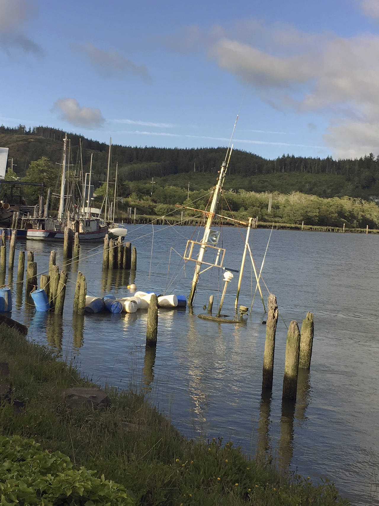 Kat Bryant | The Daily World                                Lady Grace sank in March and continues to sit on the bottom of the Hoquiam River just upstream from the Riverside Avenue Bridge.
