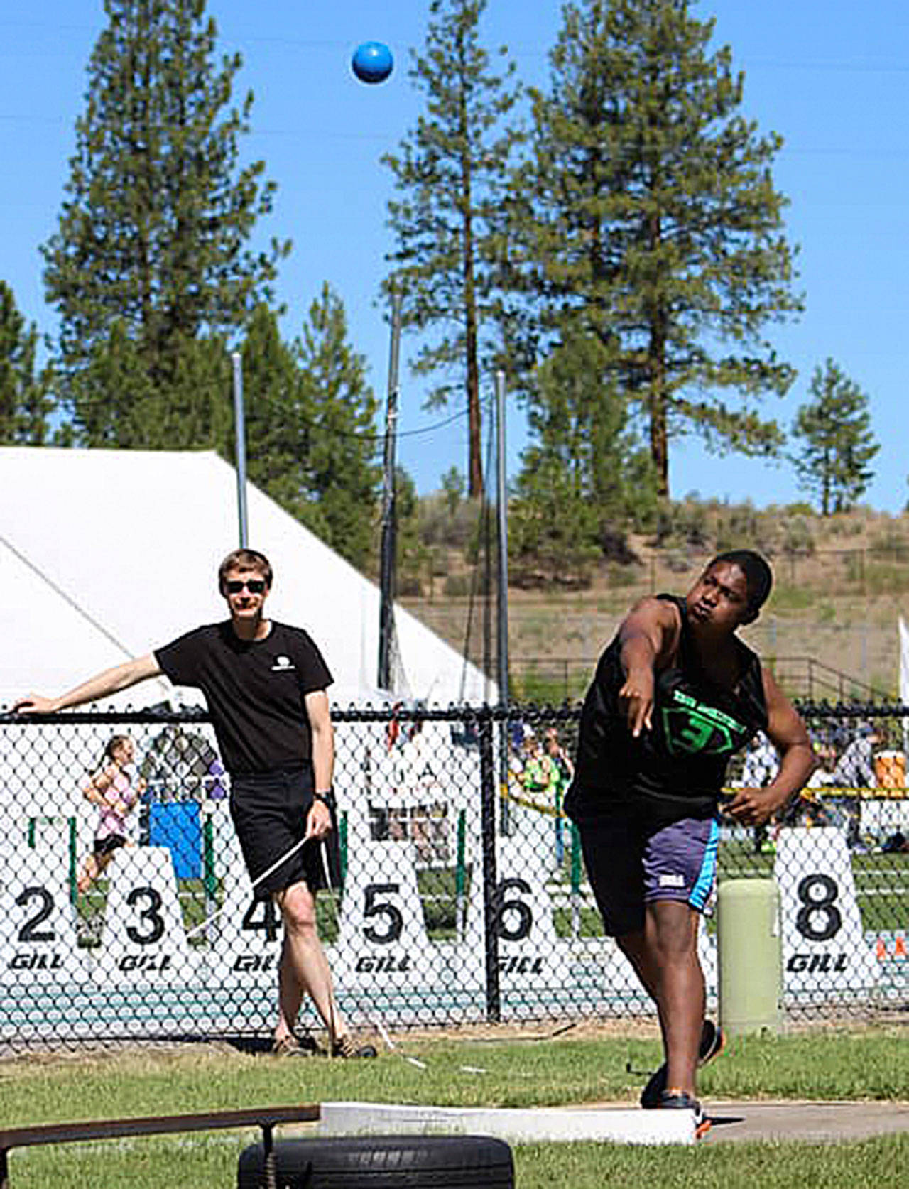 Team Evolution’s Jabron Brooks heaves a shot put nearly 38 feet to place fourth in the event in the Boys 13-14 division, qualifying him for a spot in the Junior Olympic championships July 23-29. (Photo by Sarah Navarre)
