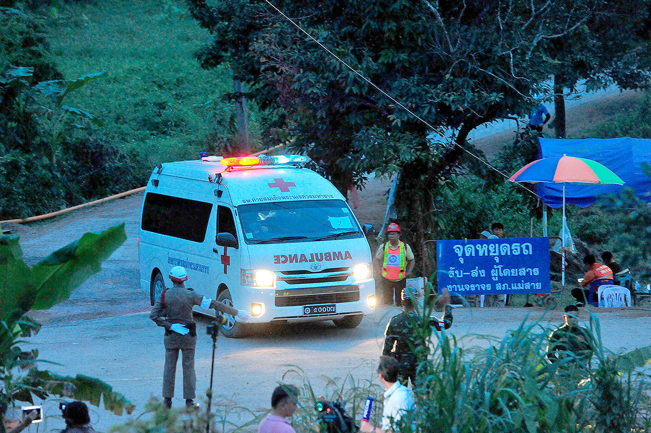 An ambulance taking a rescued boy heads for a local hospital on Tuesday in Chang Rai, Thailand. By Tuesday evening, all 12 boys and their soccer coach were rescued from the cave. (Rachen Sageamsak/Xinhua)