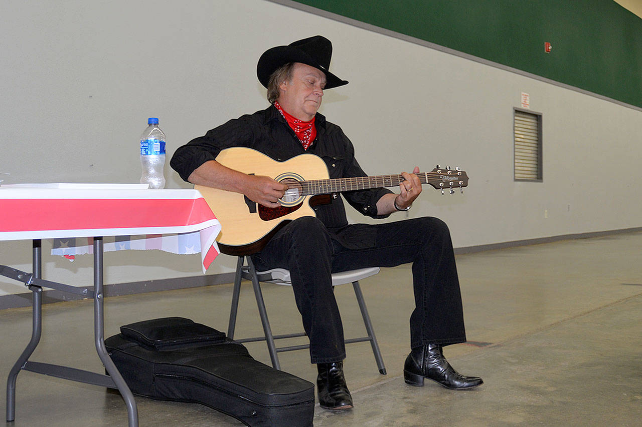 Louis Krauss | The Daily World                                Dan Whyms plays a preview of the Johnny Cash tribute he will perform Aug. 9 at the Grays Harbor County Fair in Elma.